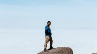 Life Happens Outdoors climber on Kilimanjaro’s Machame Route celebrating the successful ascent of the Barranco Wall.