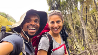 Experienced Life Happens Outdoors guide Saidi with a climber en route to Shira Camp on Kilimanjaro’s Machame Route.