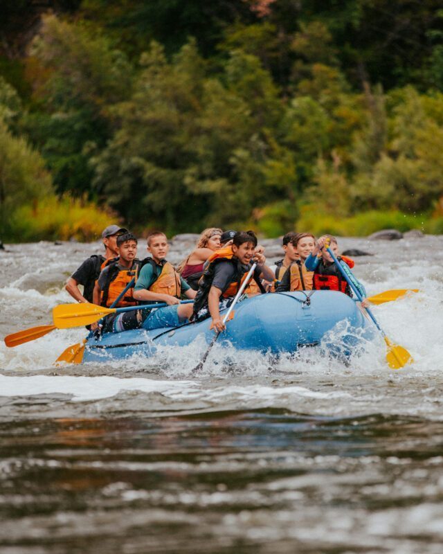 Rafting down the Chamonix River during the Ultimate Alpine Family Adventure with the Life Happens Outdoors team.