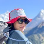 LHOer Nour Arar above Namche Bazaar on our way to Tengboche Monastery. Ama Dablam, Everest, and Lhotse can be seen in the background on a beautiful blue sky day at the junction between the Khumbu Valley and Gokyo Valley during the Everest Base Camp Trek with the Life Happens Outdoors team.