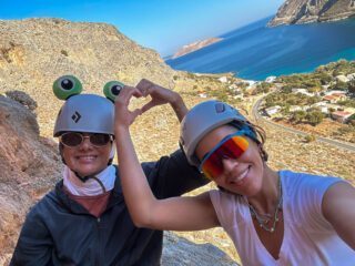 LHOers taking a break during the multi-pitch rock climbing day on Telendos during the Rock Climbing in Kalymnos adventure with the Life Happens Outdoors team.