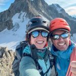 Nelly Attar and IFMGA guide François Xavier on the summit of Aiguille d'Entreves during the training and acclimatization portion of the Eiger course, with the Dent du Géant in the background and incredible views across the Glacier du Géant and the Vallée Blanche.