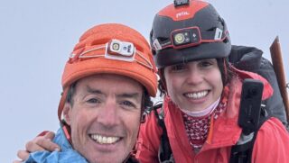 LHOer Nelly Attar and IFMGA guide François Xavier on the summit of the Eiger during the Climb the Eiger Course with the Life Happens Outdoors team.