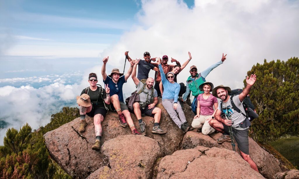 Hannah Piercy, Jean Louis Moukarzel, Kareem Salhab, and the Life Happens Outdoors team on the way to Shira Camp on the Machame Route during the Climb Kilimanjaro Expedition.