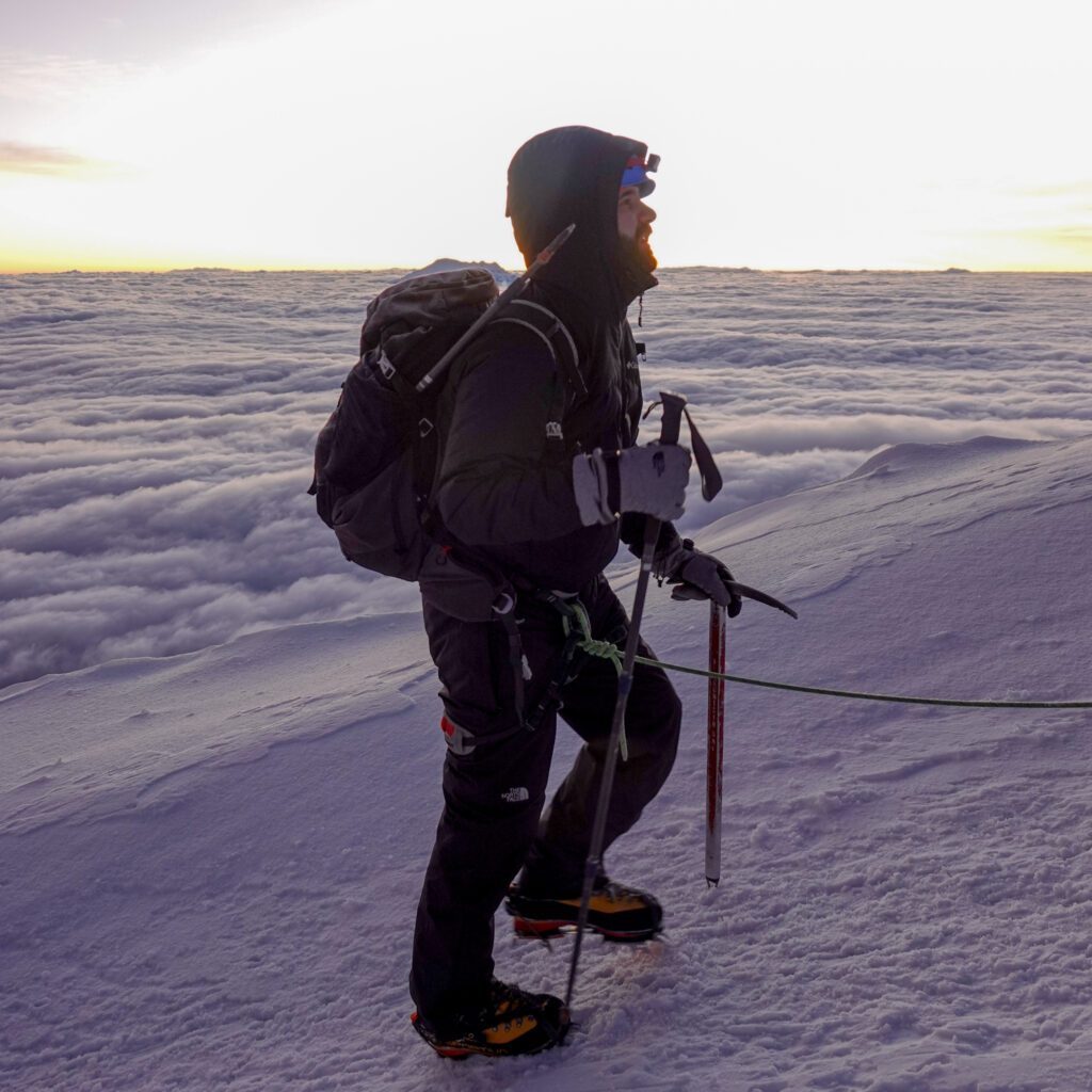 Jean Louis Moukarzel at sunrise on the shoulder of Cotopaxi on the way to the summit during the Climb Cotopaxi & Climb Chimborazo Expedition with the Life Happens Outdoors team.