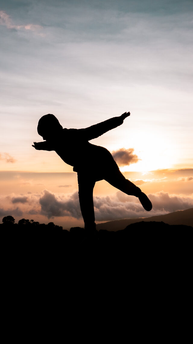 A Life Happens Outdoors trekker on mount kilimanjaro enjoying a yoga pose.