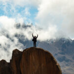 Frederic Sfeir at Kibo Hut on Kilimanjaro with Mawenzi in the background during the Climb Kilimanjaro Expedition with the Life Happens Outdoors team.