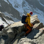 LHO IFMGA Guide Pavlos Tsiantos leading LHOer Farah Moumneh on the Marbrées Traverse during the Mont Blanc Summit Course with the Life Happens Outdoors team.