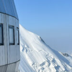 The architecture of the Goûter Hut in perfect weather during the Mont Blanc Summit Course with the Life Happens Outdoors team.
