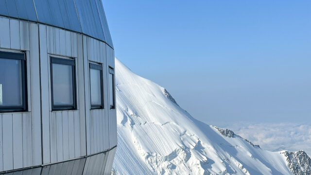 The architecture of the Goûter Hut in perfect weather during the Mont Blanc Summit Course with the Life Happens Outdoors team.