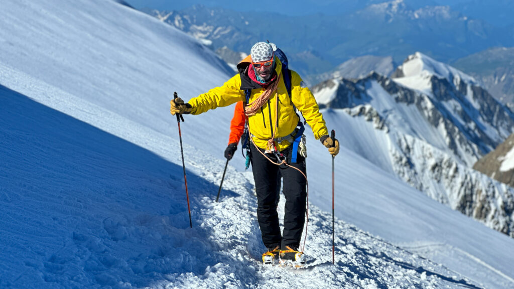 LHO guide Babis Marinidis leading the Life Happens Outdoors team on the Dôme du Goûter during the Mont Blanc summit push of the Mont Blanc Summit Climb course.