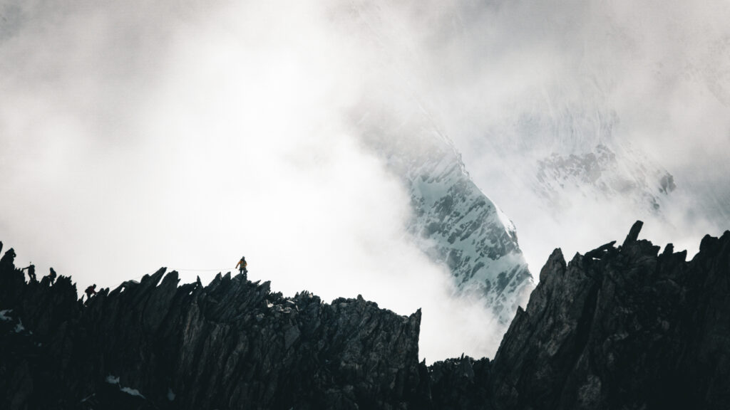 IFMGA guide Babis Marinidis crossing the Marbrées Traverse during Mont Blanc training days from the Torino Hut.