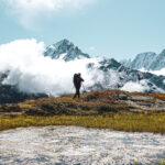 The Life Happens Outdoors team trekking beneath Lac Blanc during the Tour du Mont Blanc (TMB).