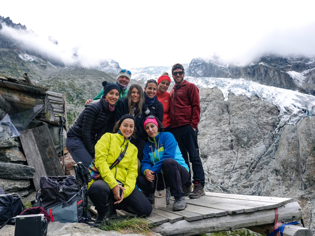 The Life Happens Outdoors team trekking above Trient towards the Fenêtre d'Arpette on the way to Champex-Lac during the Tour du Mont Blanc (TMB).