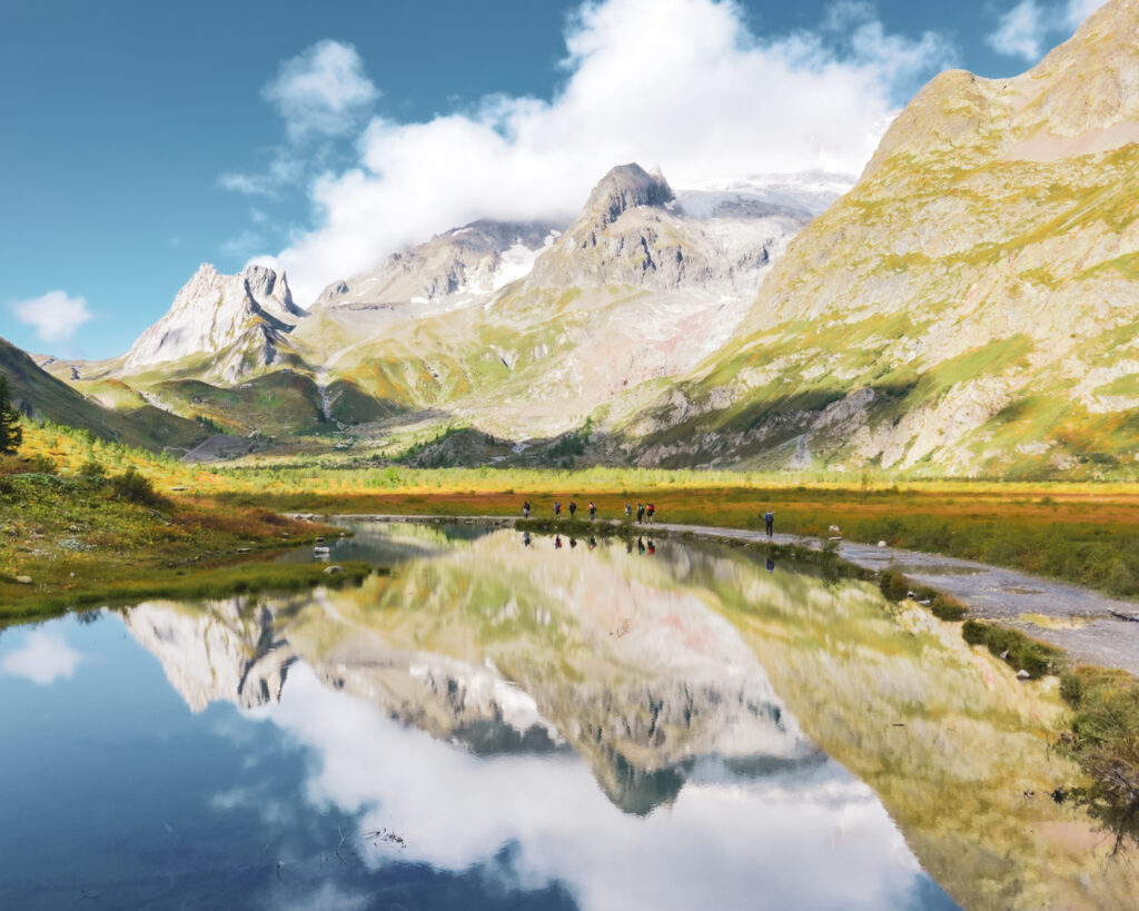 The Life Happens Outdoors team passing the lakes of Val Veny next to Courmayeur on the way to Col de la Seigne during the Tour du Mont Blanc (TMB).