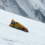 LHO IFMGA guide Pavlos Tsiantos chilling on the Dôme du Goûter during great weather on the way down from the Mont Blanc summit with the Life Happens Outdoors team.