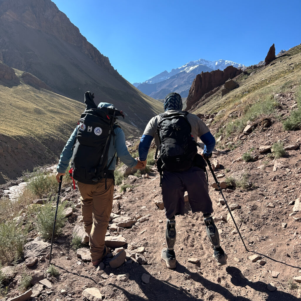Hari Budha Magar with Abiral Rai during our first day of trekking on the way to Confluencia Camp, with the South Face of Annapurna dominating the skyline at the very start of the trek during the Annapurna Base Camp Trek with the Life Happens Outdoors team.
