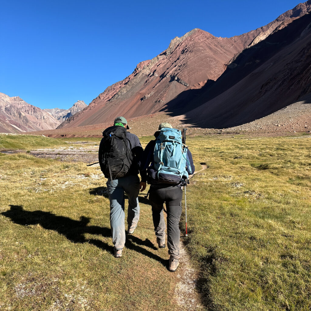 Frederik Sfeir, who has retinitis pigmentosa, and his childhood friend Khalil Chehab trekking from Confluencia to Plaza de Mulas to catch up with Hari Budha Magar during the Aconcagua Expedition with the Life Happens Outdoors team.