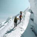 Life Happens Outdoors team climbing Mont Blanc on the summit ridge with glaciers in view during the Climb Mont Blanc Summit Course.