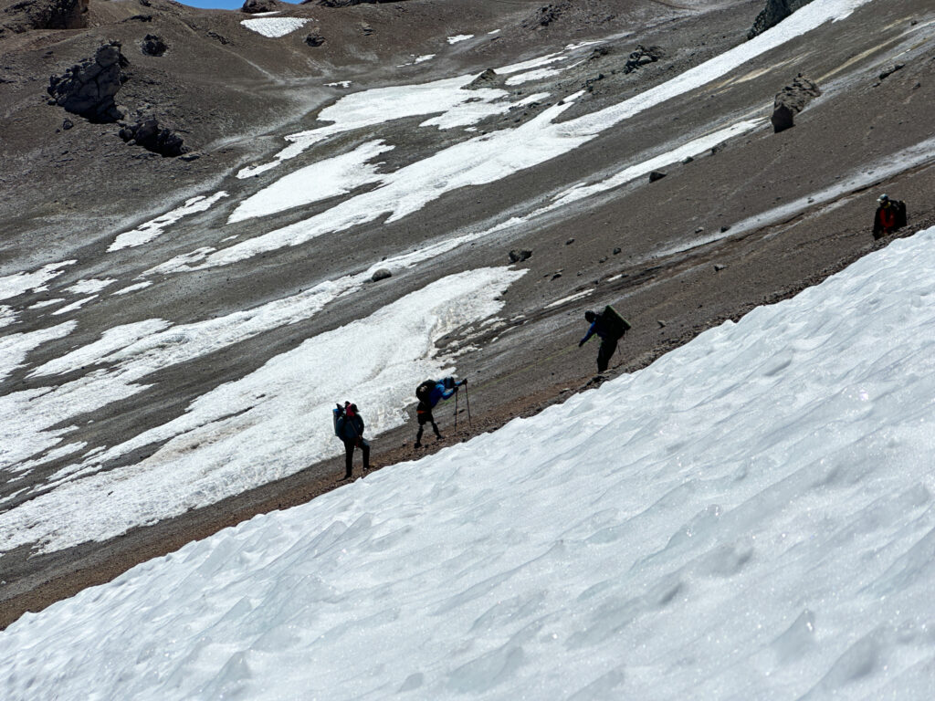 Hari Budha Magar, Abiral Rai, and Mingma Phortse Sherpa working together as a rope party moving between Camp 1, Plaza Canadá, and Camp 2, Nido de Cóndores during the Aconcagua Expedition with the Life Happens Outdoors team.