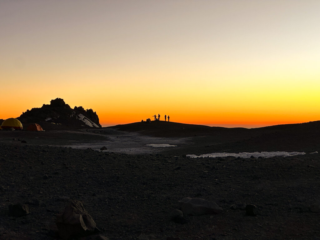 The Life Happens Outdoors team, including Hari Budha Magar, enjoying the sunset from Camp 2, Nido de Cóndores, during the successful Aconcagua Expedition.