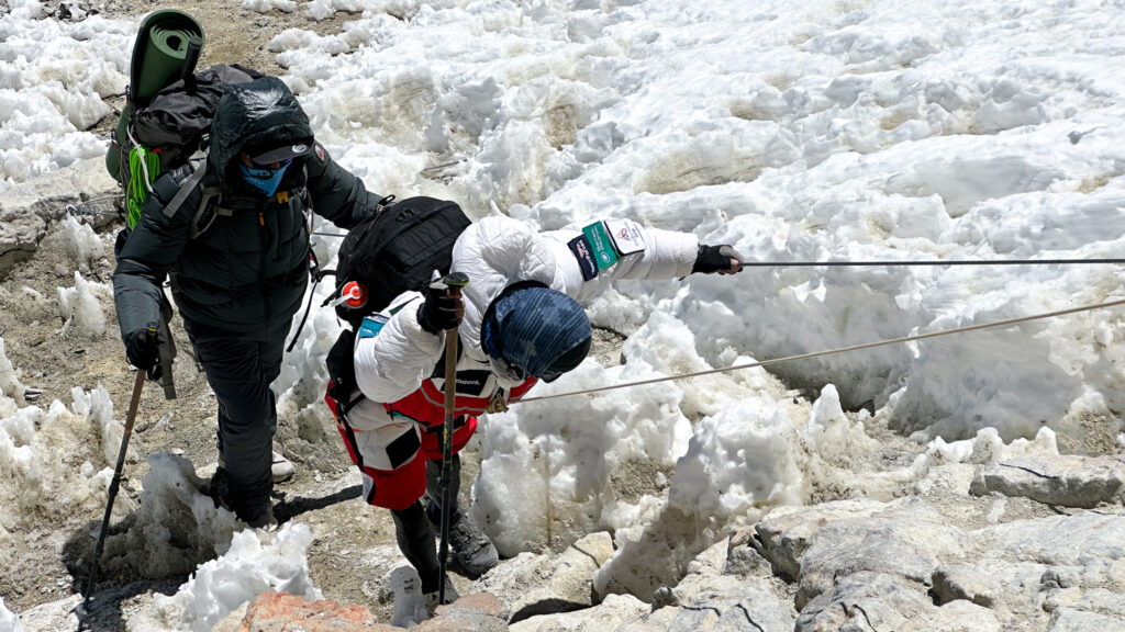 Hari Budha Magar reaching Camp 3, Colera, ahead of all the other teams, marking a huge shift in momentum and thinking within our expedition for how to tackle the summit. Hari is surrounded by penitentes, ice shards on the ground formed by snow and wind on Aconcagua, during the Aconcagua Expedition with the Life Happens Outdoors team.