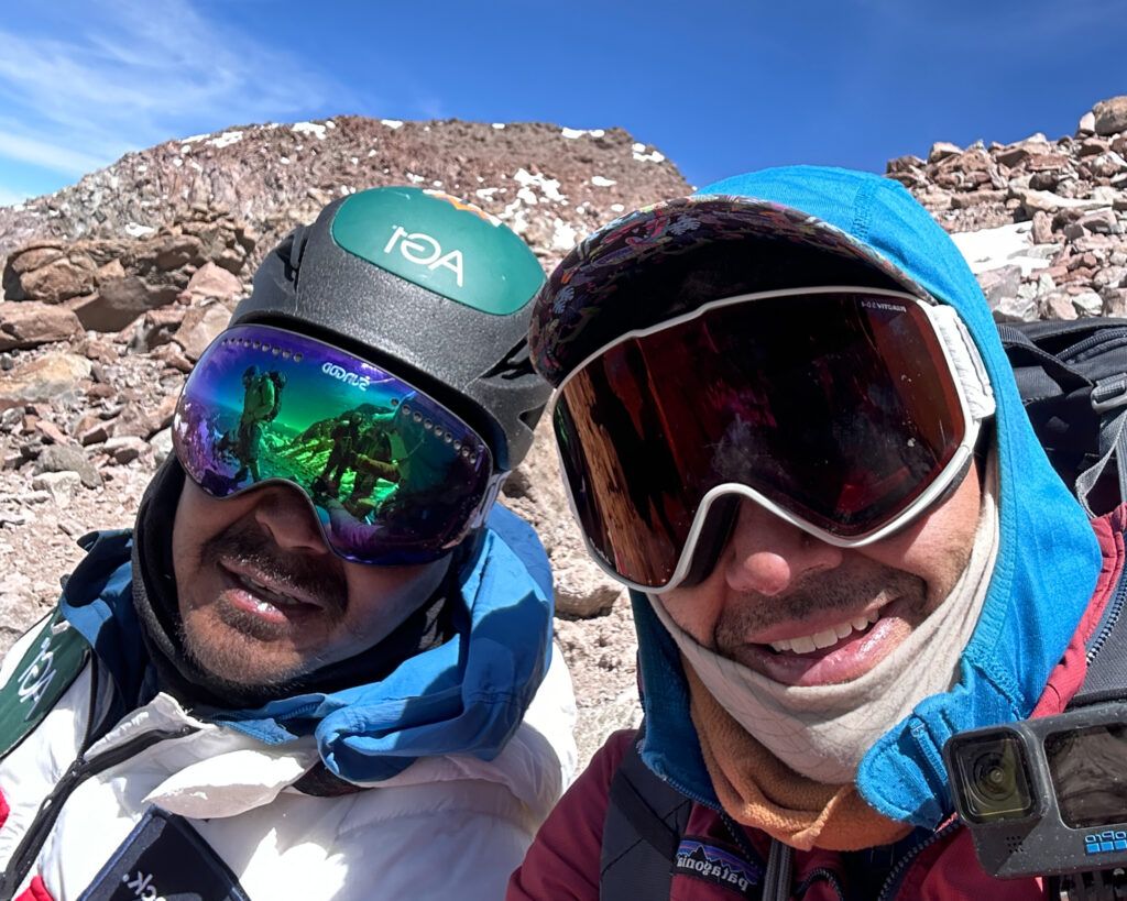 Hari Budha Magar and Rami Rasamny at the cave on the way up to the summit of Aconcagua. The sun was out, the weather was good, and although Hari was tired, he was committed during the Aconcagua Expedition with the Life Happens Outdoors team.