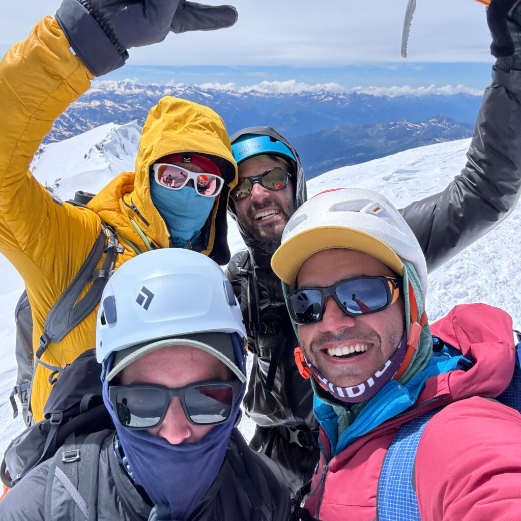 LHO guide Pavlos Tsiantos on the summit of Mont Blanc during the Mont Blanc Summit Climb course with the Life Happens Outdoors team.