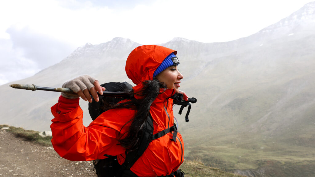 LHO team member in the village of La Fouly, Switzerland, on the Tour du Mont Blanc trail heading toward Grand Col Ferret and the Swiss–Italian border.