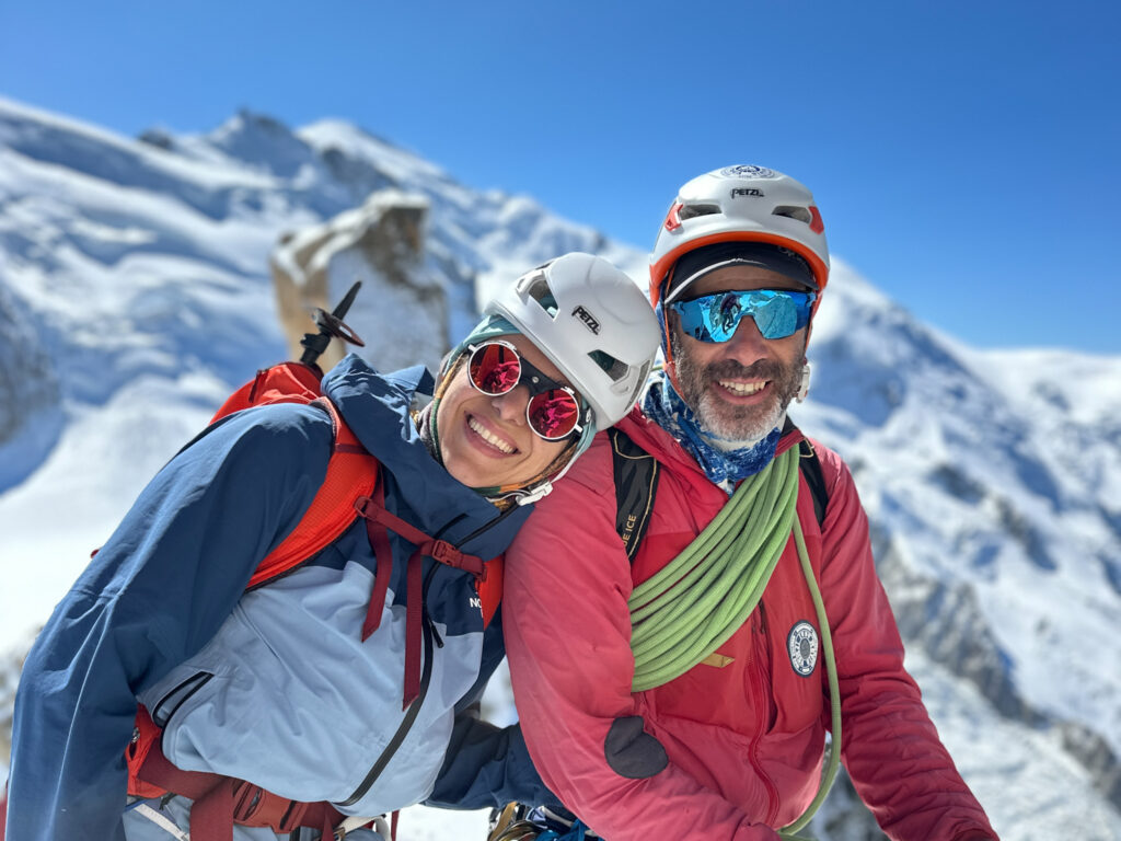 LHO Team Leader Ranwa Zahr and IFMGA guide Babis Marinidis together on the Arête Cosmique (Cosmic Ridge) during the training days on the Mont Blanc Summit Course with the Life Happens Outdoors team.
