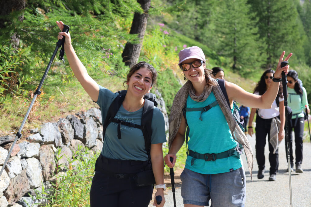 Happy Life Happens Outdoors trekkers on the first day of the Tour du Mont Blanc enjoying sunny t-shirt weather on the Swiss side of the trail