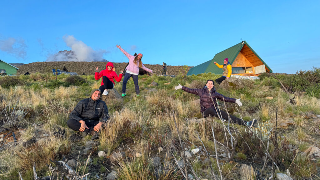 LHO climbers posing for a group photo at Horombo Hut on Mount Kilimanjaro during their Kilimanjaro trek, preparing to climb Africa’s highest peak.