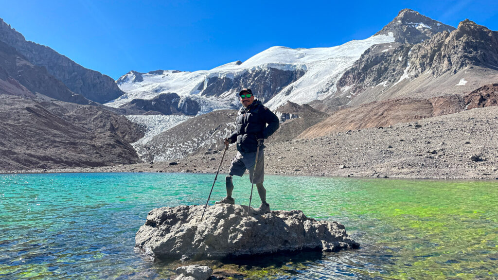 Hari Budha Magar, the first double above-knee amputee to climb Aconcagua, at Green Lake near base camp with Life Happens Outdoors.