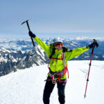 LHO team member standing on the Mont Blanc summit at sunrise, fully equipped with climbing gear after a successful Mont Blanc climb