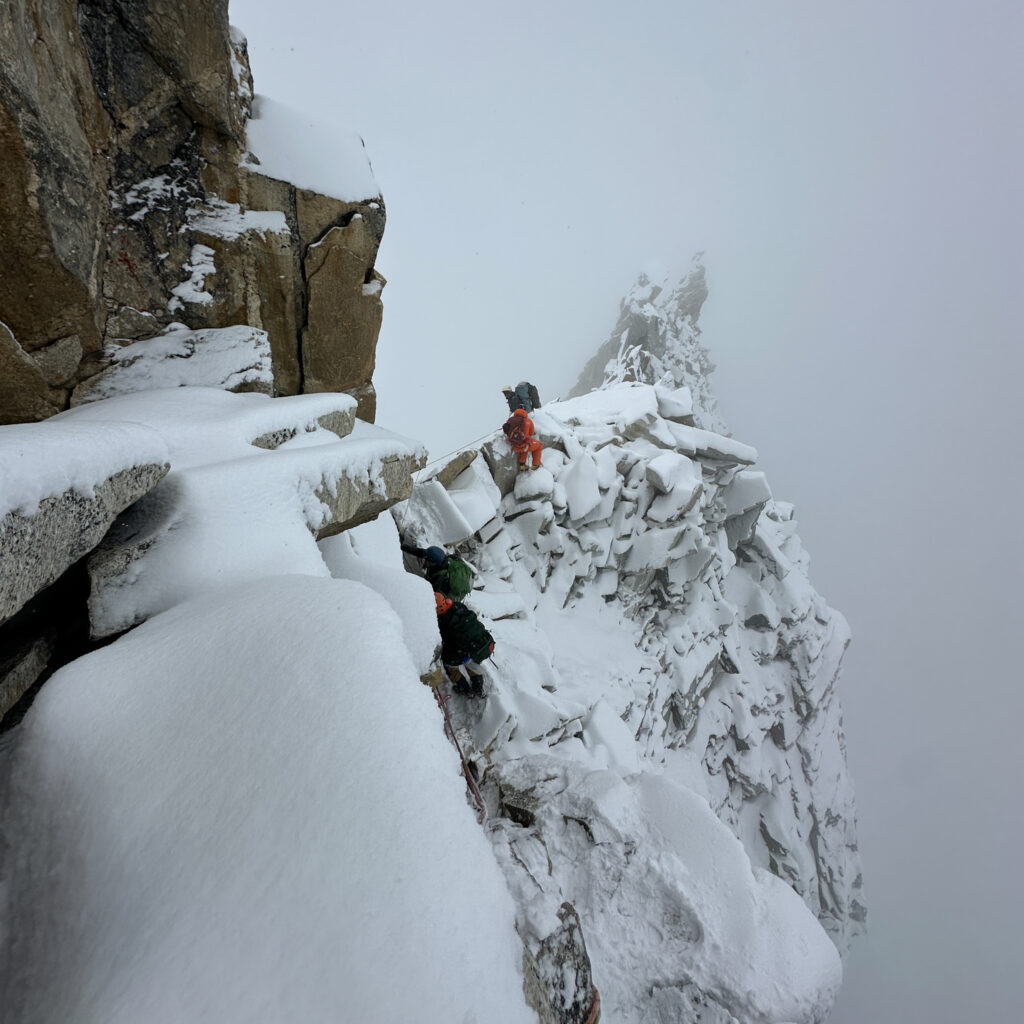 Treacherous snowy terrain beneath Camp 2 on Ama Dablam, with deep snow and low visibility highlighting the severity of mountain conditions.