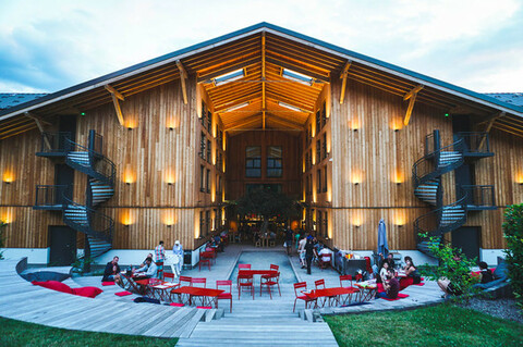 Entrance to the RockyPop Hotel with modern signage, glass doors, and mountain-themed decor welcoming guests to the Chamonix valley.