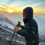 13-year-old Christopher Abboud climbing Mount Kilimanjaro at sunrise just below the summit during Life Happens Outdoors expedition for HALO Trust.