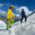 Pavlos, an IFMGA mountain guide with Life Happens Outdoors, teaching the basics of self arrest on the first day of the Mont Blanc Summit Course, part of the article Can I Climb Mont Blanc as a Beginner.