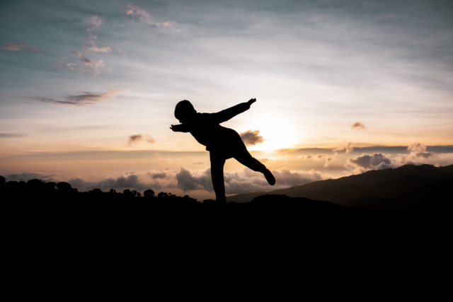 Life Happens Outdoors community member on a corporate Kilimanjaro challenge trek, capturing the spirit of a purpose led team retreat