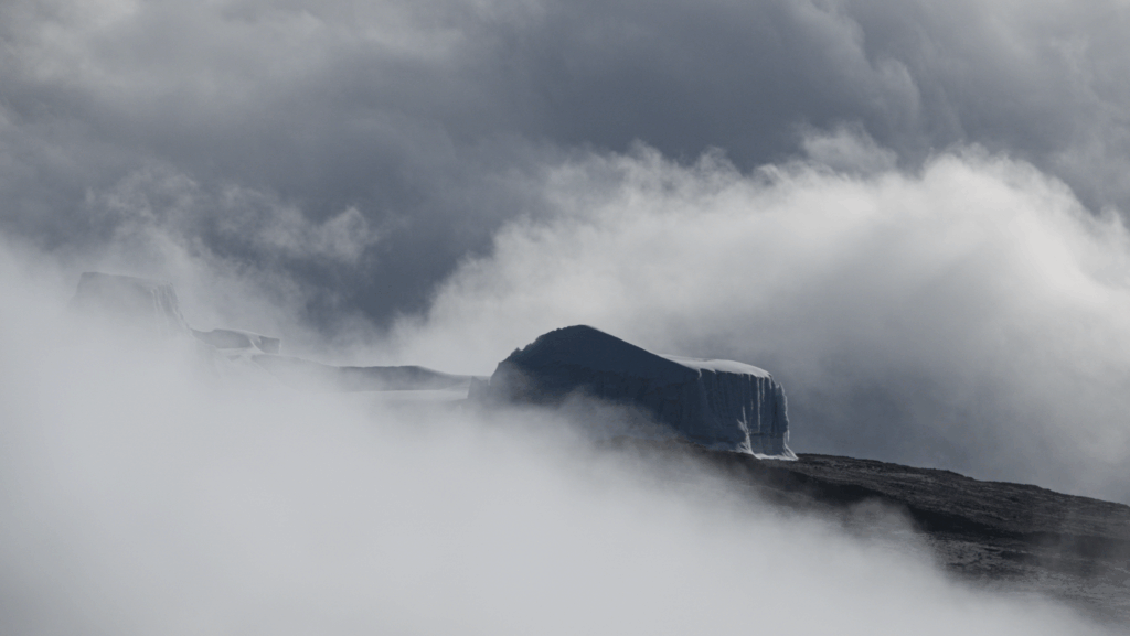 Kilimanjaro glacier emerging through clouds on the crater rim with Life Happens Outdoors