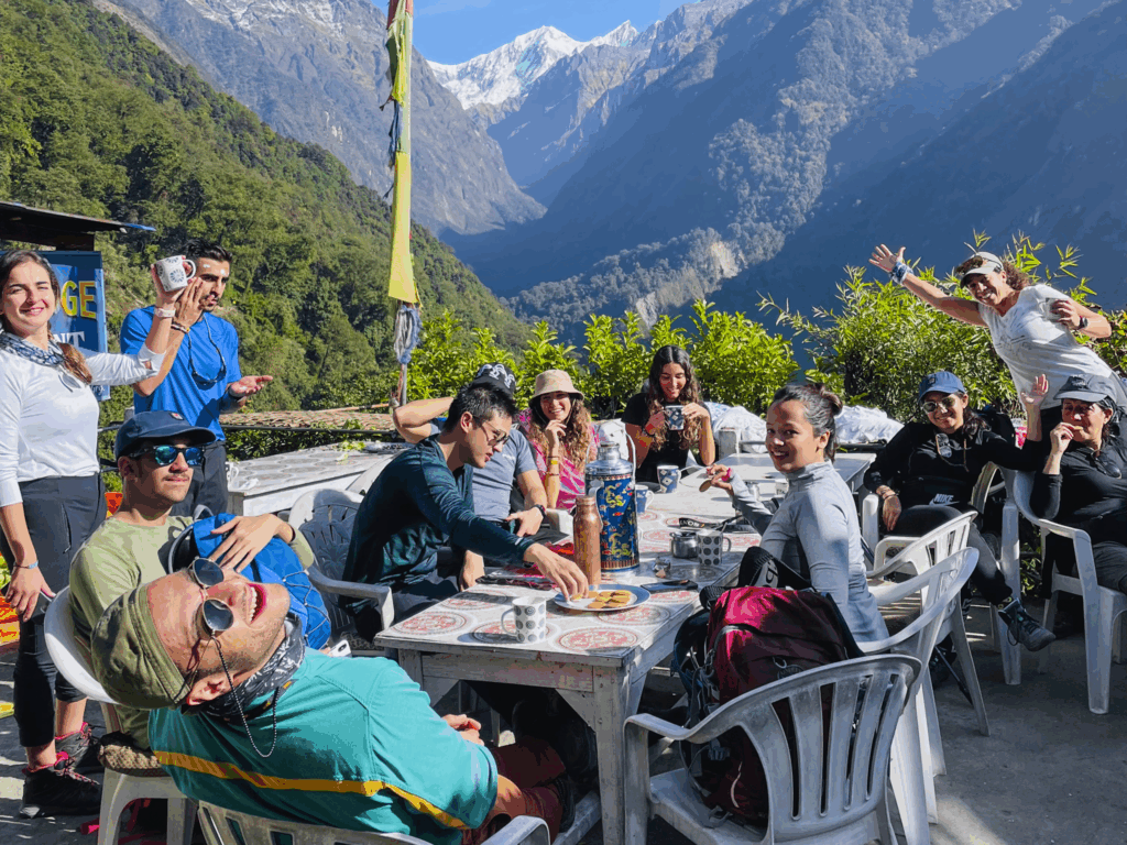 A group of Life Happens Outdoors community members trekking to Annapurna Base Camp, resting together at a tea house.