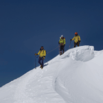 Life Happens Outdoors climbers crest the first mogul on the Mont Blanc summit push in clear weather