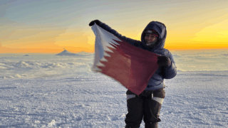 Life Happens Outdoors community member standing on the summit of Chimborazo after a powerful climbing journey.