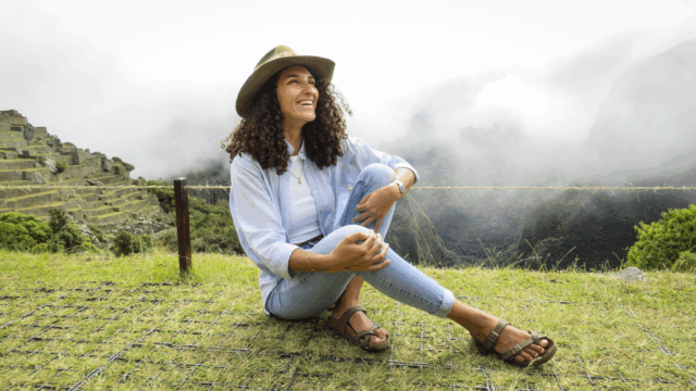 Life Happens Outdoors community member enjoying a quiet solo moment of reflection at Machu Picchu in Peru.