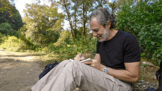 Life Happens Outdoors community member relaxing and writing reflections during a trekking journey in Nepal.