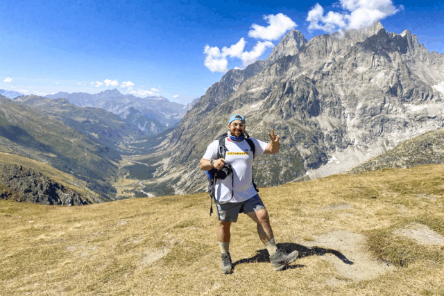 Life Happens Outdoors Team Leader on the Tour du Mont Blanc at Grand Col Ferret on the Switzerland Italy border.