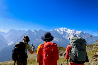 Life Happens Outdoors team taking in wide views of the Mont Blanc massif during the Tour du Mont Blanc trek.