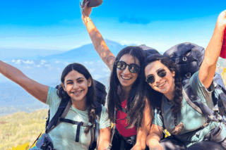 Life Happens Outdoors community members on Kilimanjaro, an all women team smiling together on the mountain.