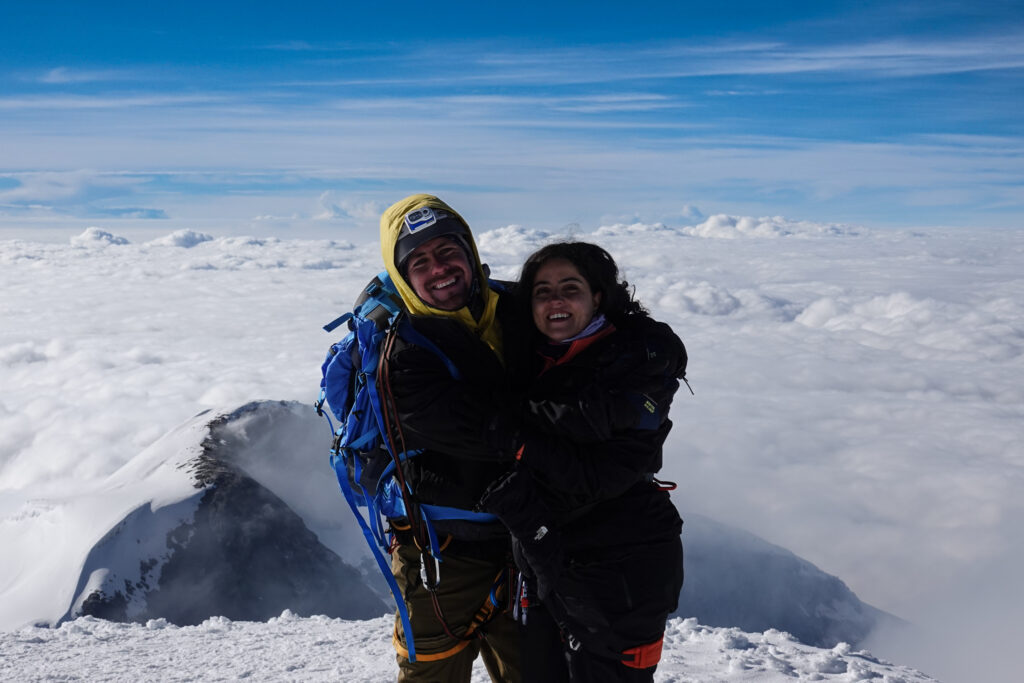 Two Life Happens Outdoors members celebrating on the summit of Cotopaxi during the Chimborazo and Cotopaxi expedition