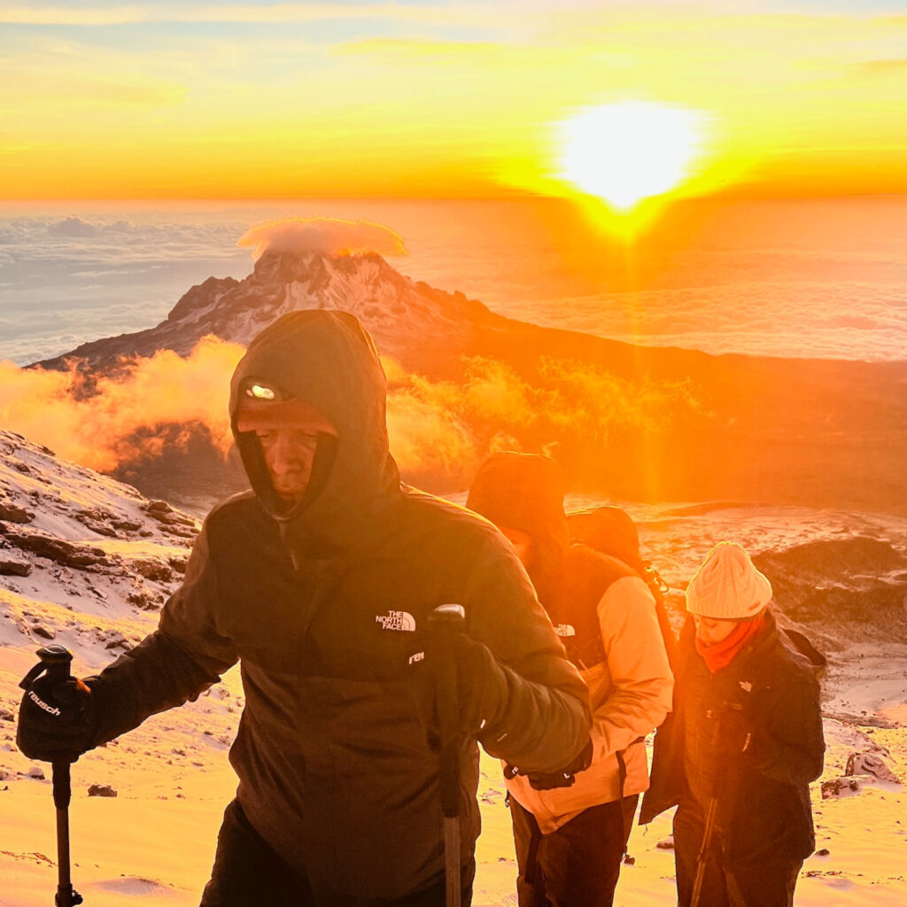 Horizon glow on Kilimanjaro moments before the summit as sunlight returns and the Life Happens Outdoors team pushes on toward Uhuru Peak